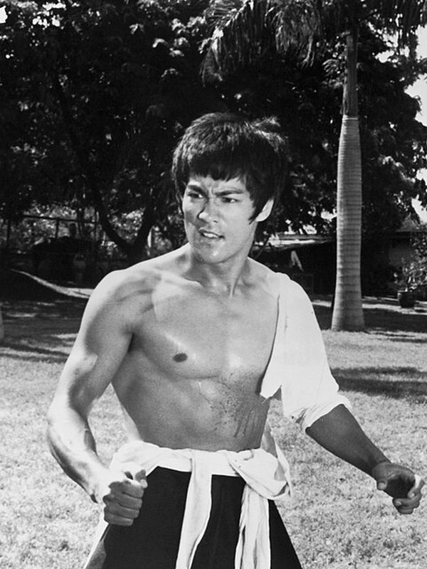 Bruce Lee in a black-and-white film still