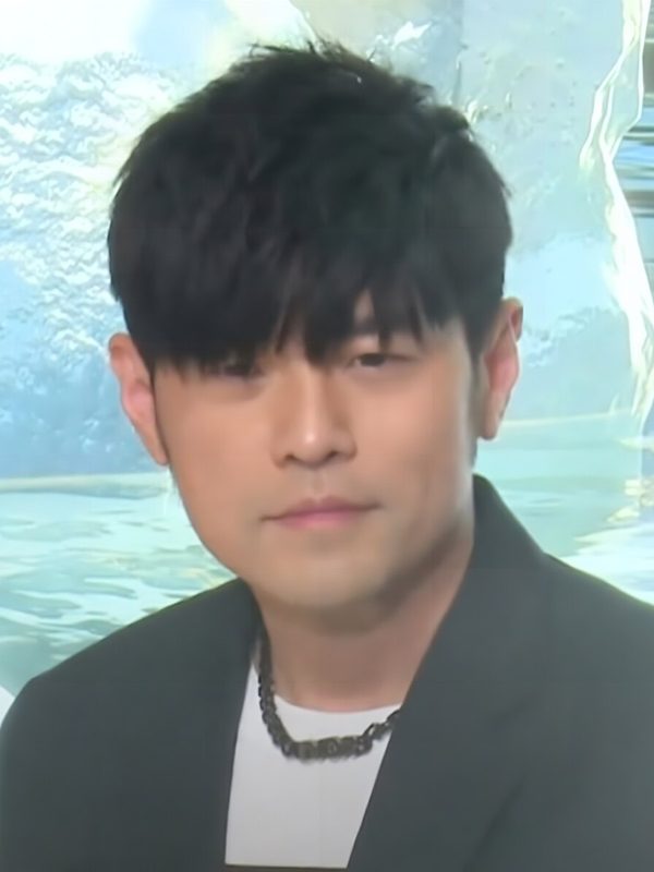 Jay Chou with dark hair, close up